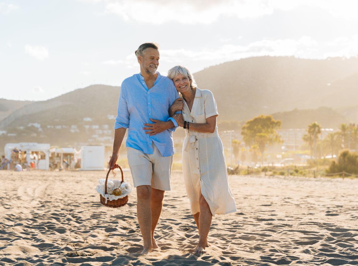 Senior couple walking on a beach